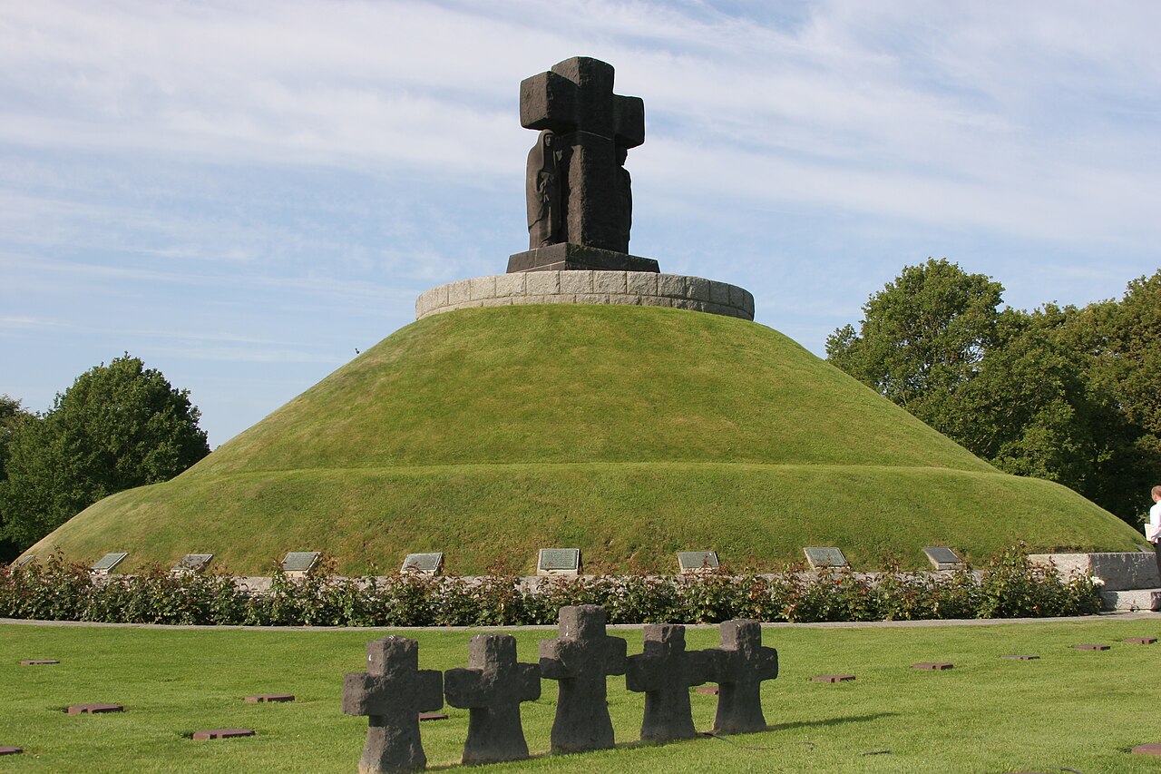 U.S., French, Canadian, and German Soldiers gather at the La Cambe German war cemetery, June 2009
