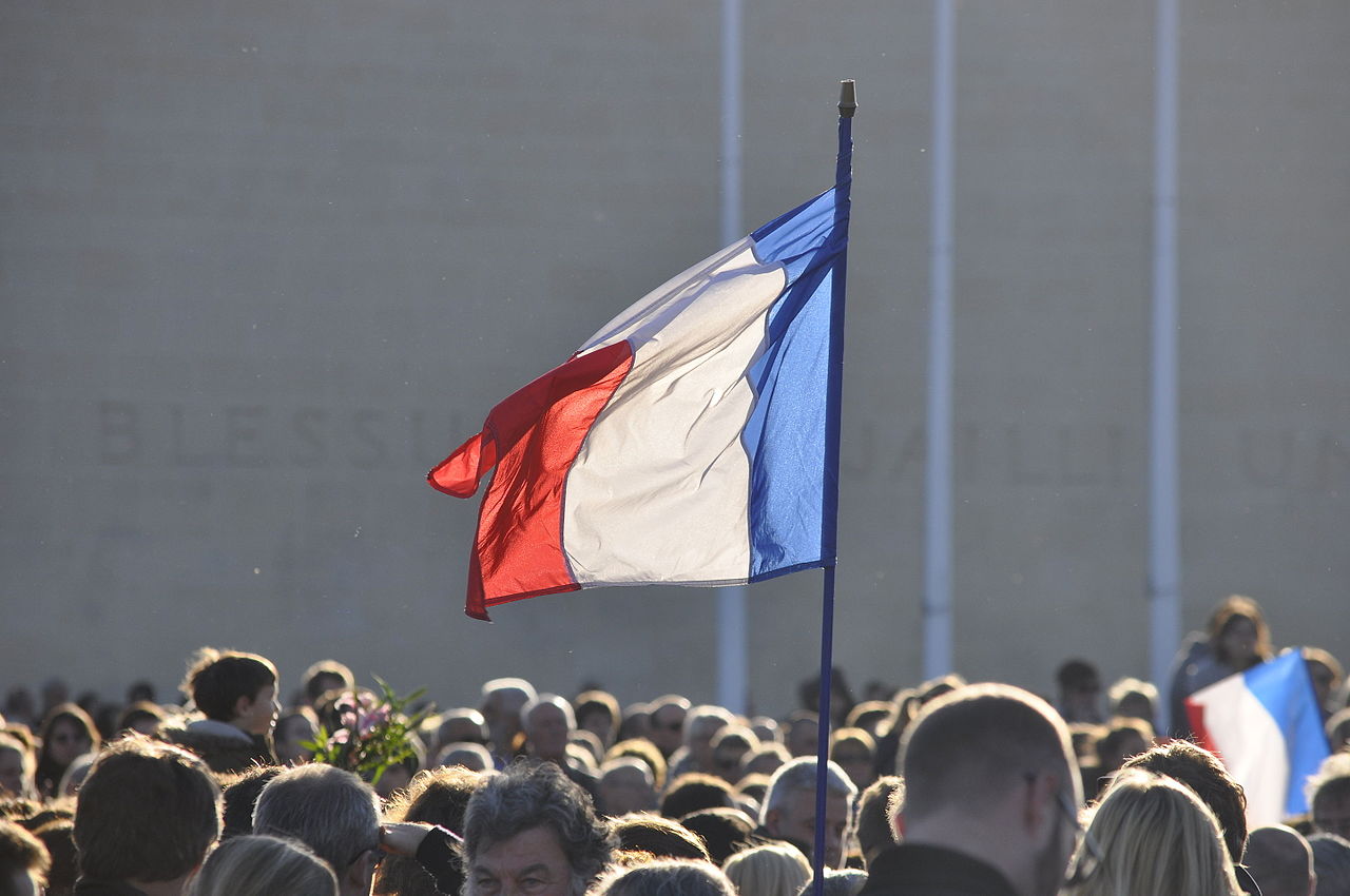French flag flying in front of the Mémorial de Caen, November 2015