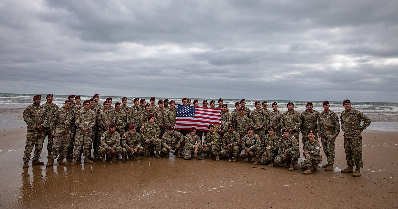 U.S. Army Paratroopers pose on Omaha Beach for the 80th anniversary of D-Day, June 2024